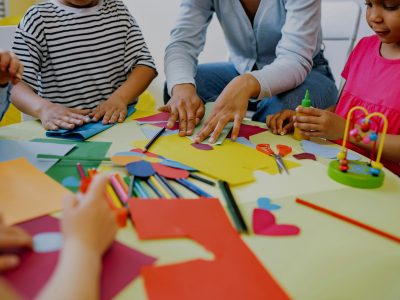children in a circle playing in a childcare centre